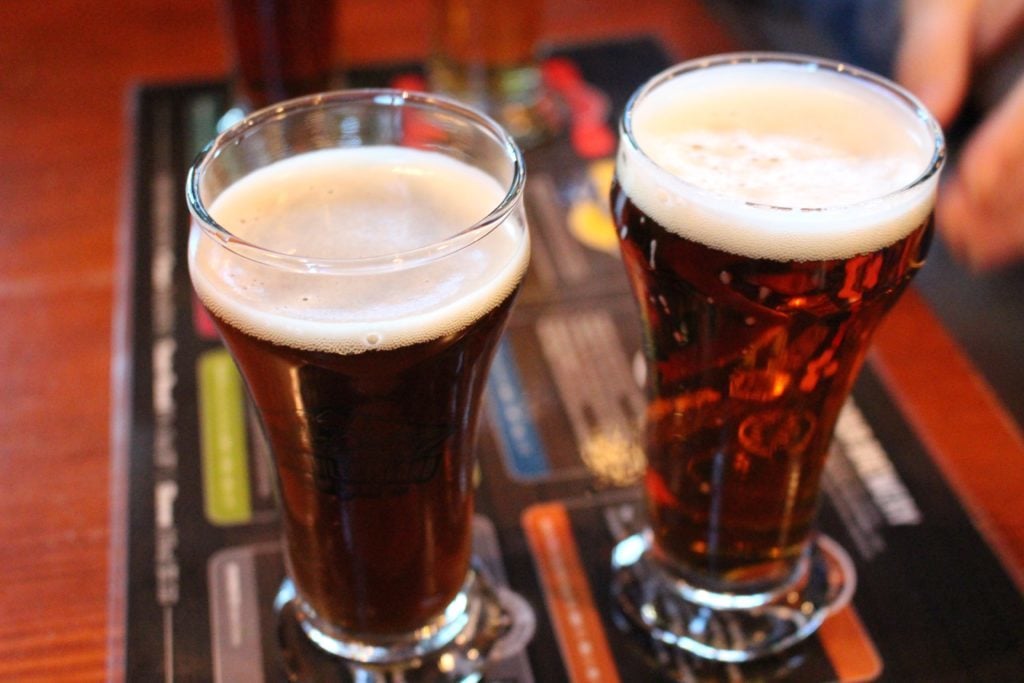 Two craft beers in tall glasses