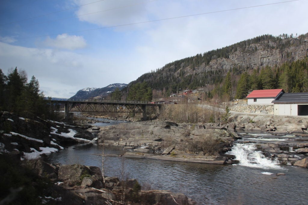 Bridge over a fjord with houses nearby