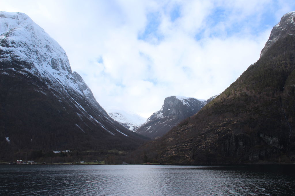Cruising the beautiful fjords in Norway with views of snow-dusted mountains