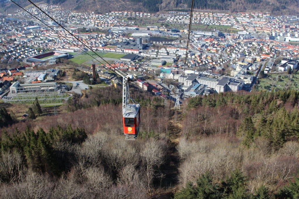 The Ulriken643 cable car above the mountain trees. Take the cable car to the peak of Mr. Ulriken, before you go hiking in Bergen, Norway.