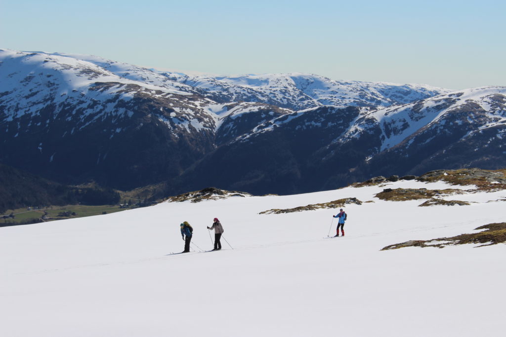 Group of people skiing on the snowy mountain