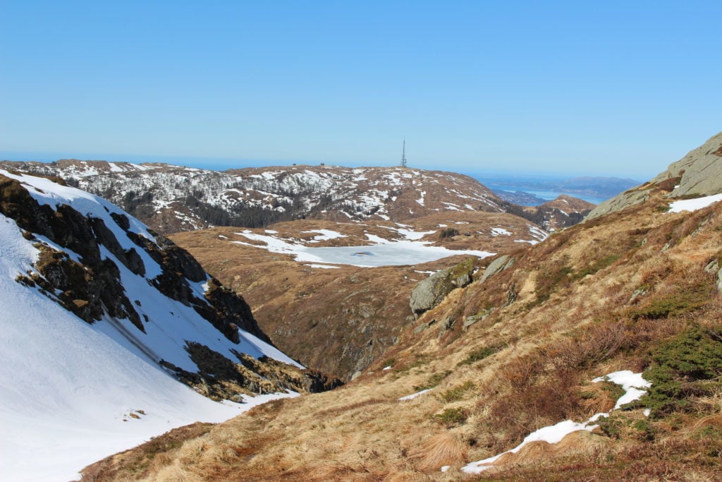 Partly snowy mountains under the blue skies