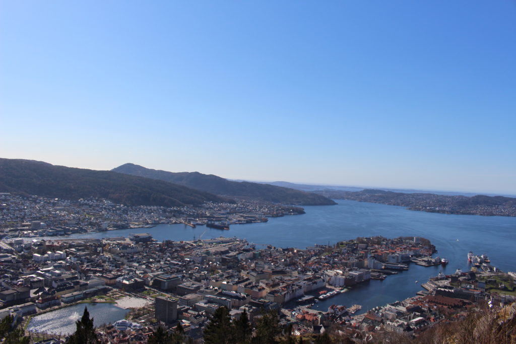 View of the town of Bergen and its beautiful landscape from above. Hiking from Mt. Ulriken to Mt. Fløyen is one of the best hikes in Bergen.