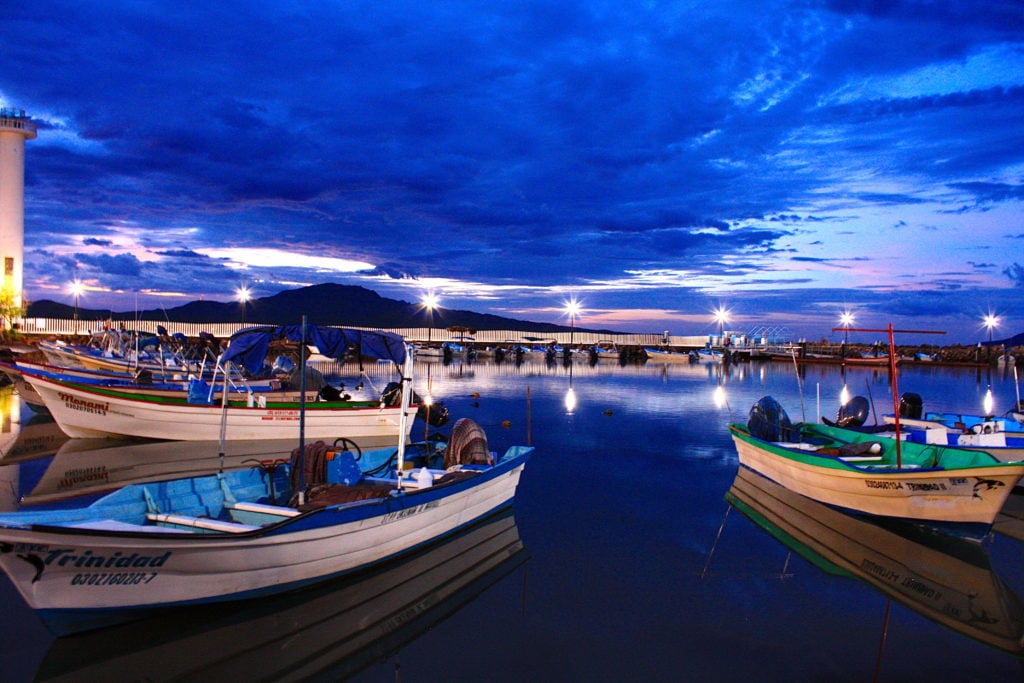 Boats docked during the night. In this Loreto travel guide, Day 2 includes food adventures and exploring more of Loreto.