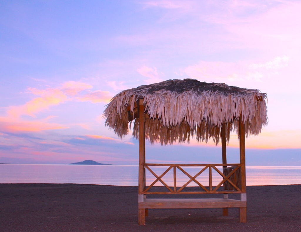 Palapa in Loreto, Mexico. If you love an authentic experience, delicious food, beautiful scenery, reasonable prices, and happy people, you may have just discovered your next vacation destination. Loreto is also the perfect place to deep-sea fish, whale watch, stand-up paddle board, kayak, snorkel, hike, golf, and lounge at the beach. Loreto's mountain, ocean, and island views are also a major plus. See our Loreto travel guide for the best things to do in Loreto, plus where to stay and where to eat!