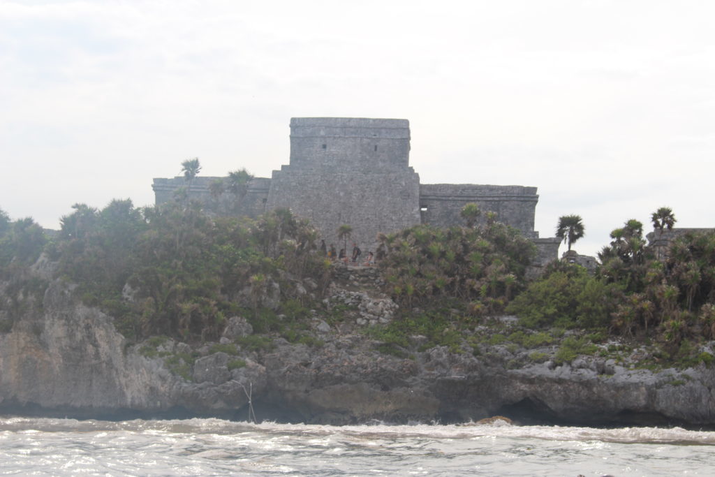 Ancient Mayan temple on a rocky cliff in Mexico