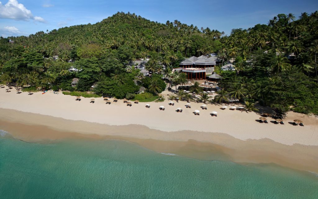 Aerial view of the Surin Beach where you can find The Surin Phuket. If you're wondering where to stay in Phuket, this resort hotel is one of the best areas.