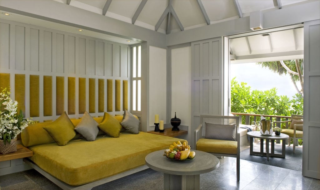 Comfy bedroom in a beach cottage at The Surin Phuket