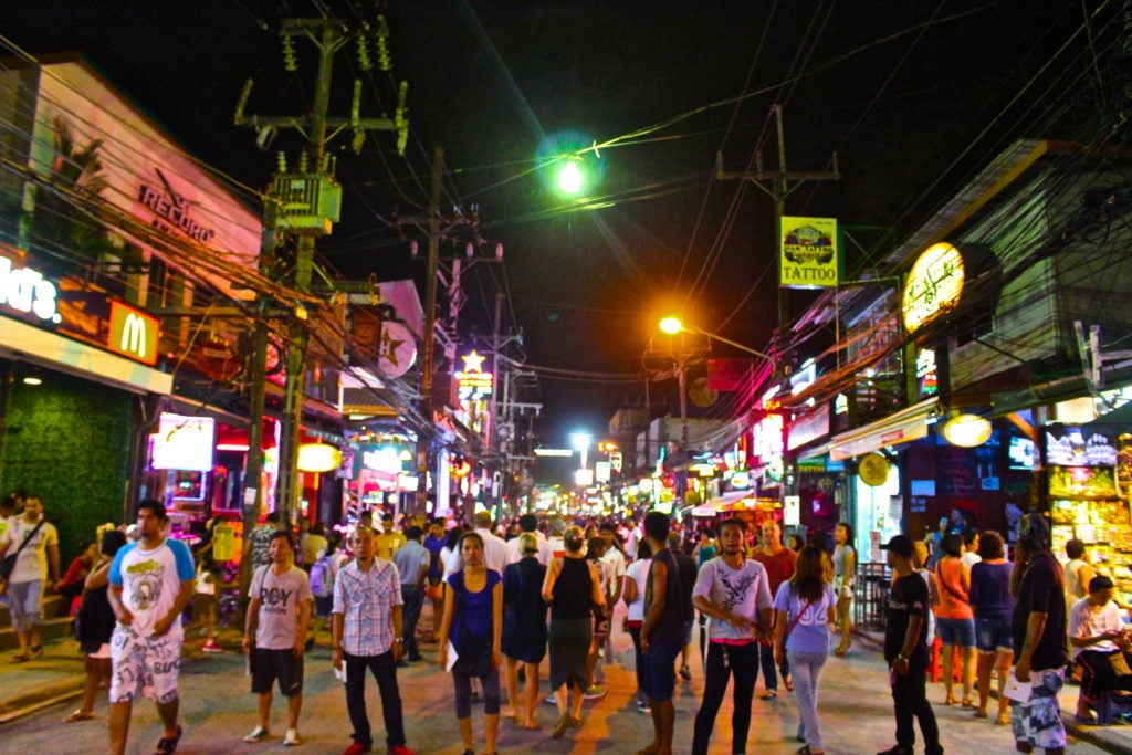 Crowds of people in Patong at night. This guide to Phuket recommends Patong as one of the best nightlife experiences in Phuket, Thailand.