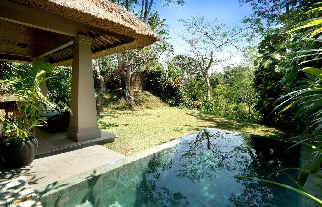 Tranquil pool surrounded by the beautiful nature at Maya Ubud Resort & Spa in Bali