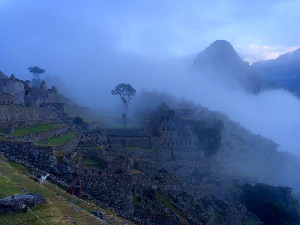 Thick clouds covering the ruins of Machu Picchu 