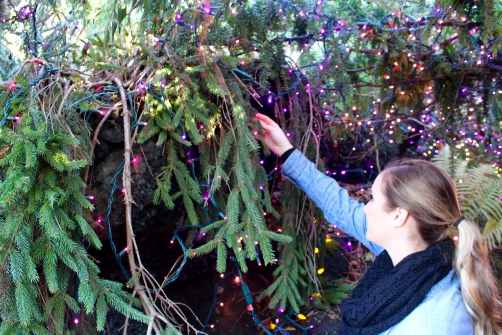 Maddy checking out the colorful display lights at VanDusen Botanical Garden. Wondering what to do in Vancouver? This botanical garden is one of the best places to visit especially on springtime.