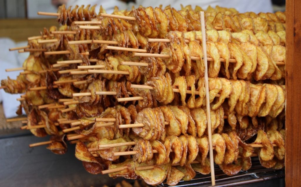 Spiraled potato chips on sticks at Prague's Old Town Square Christmas Market