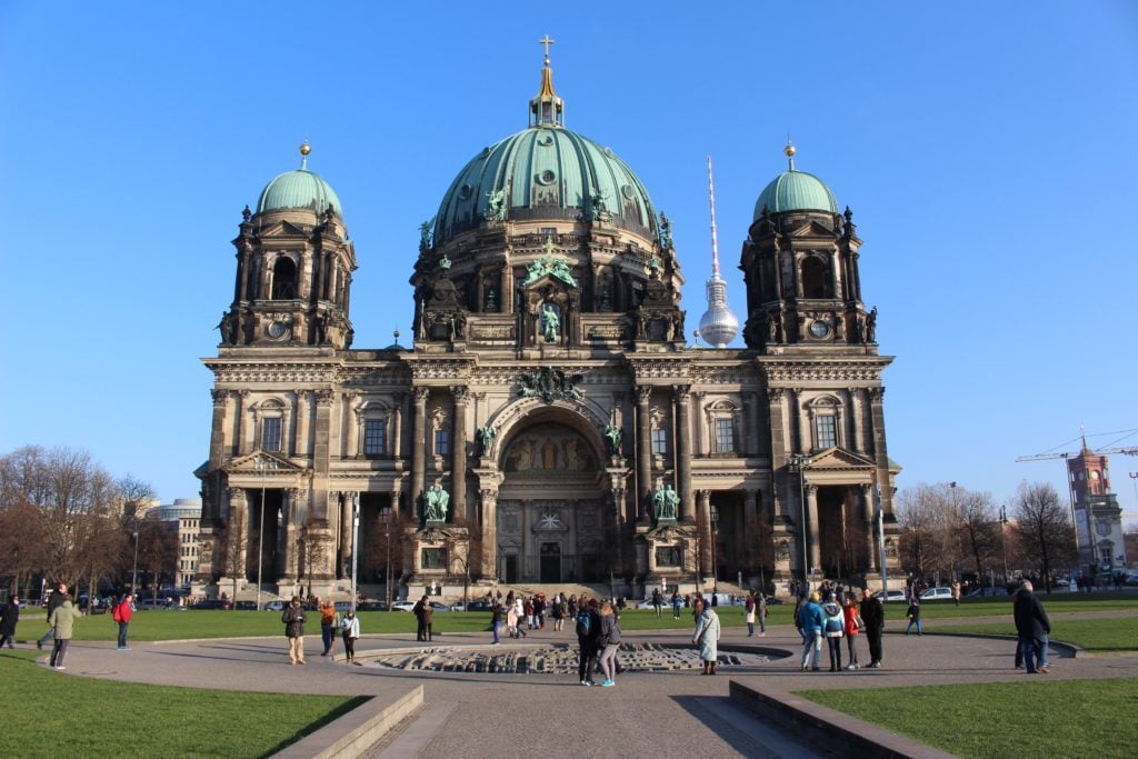 People roaming around the Berlin Cathedral on a sunny day