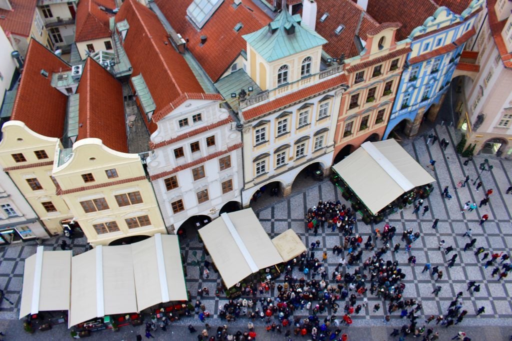 People roaming around Prague's Old Town Square Christmas Market at daytime