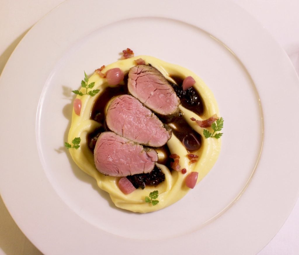 Juicy pork tenderloin dish - a fine dining experience at the Aria Hotel Prague