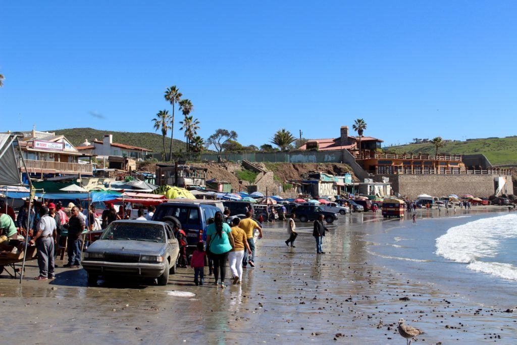 People wandering by the beach at Popotla