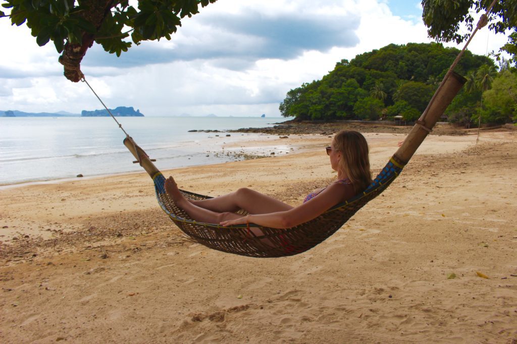 Maddy on a woven hammock while taking a rest island hopping in Thailand