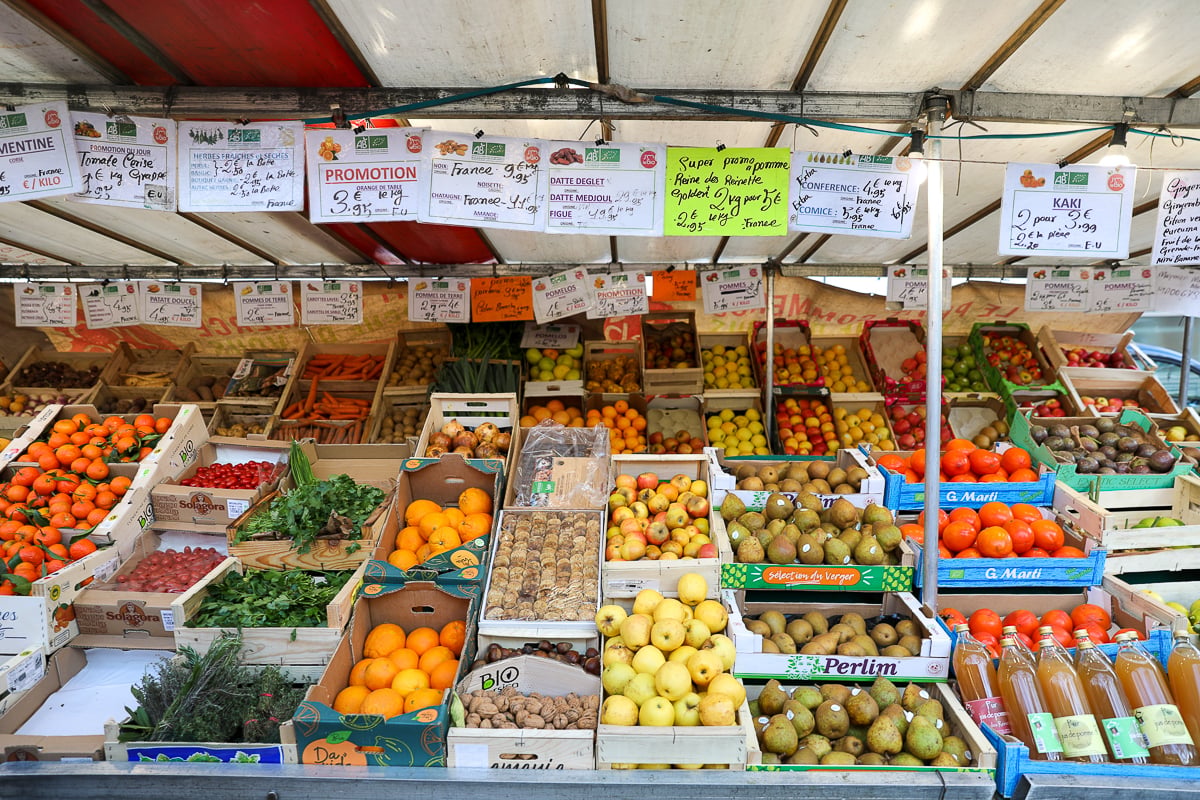 Food market stall in Paris, France, with fresh fruit and vegetables.