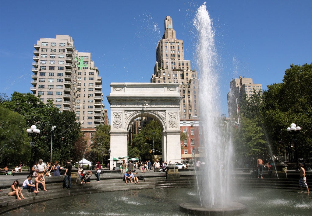 People hanging out by the fountain in Washington Square Park