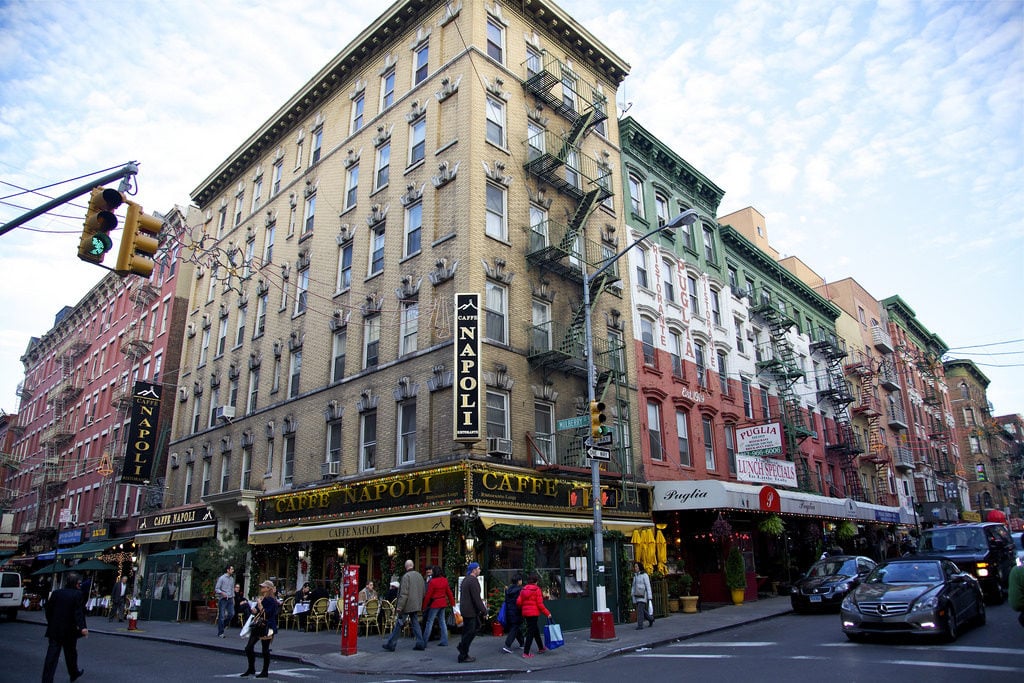 People walking around NYC's Little Italy in the afternoon