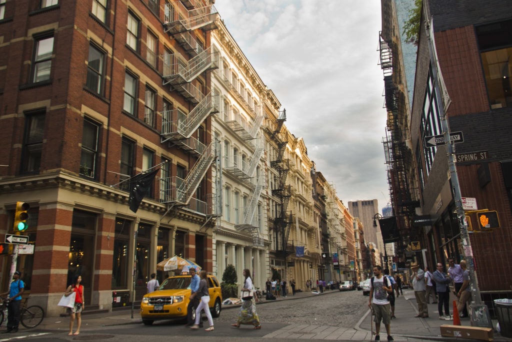 People shopping and walking around in SoHo, NYC.