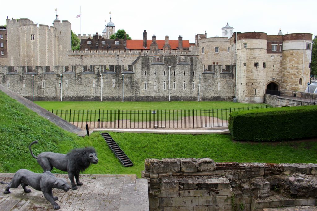 Ground around the Tower of London with Lion statues and entrance to the gatehouse