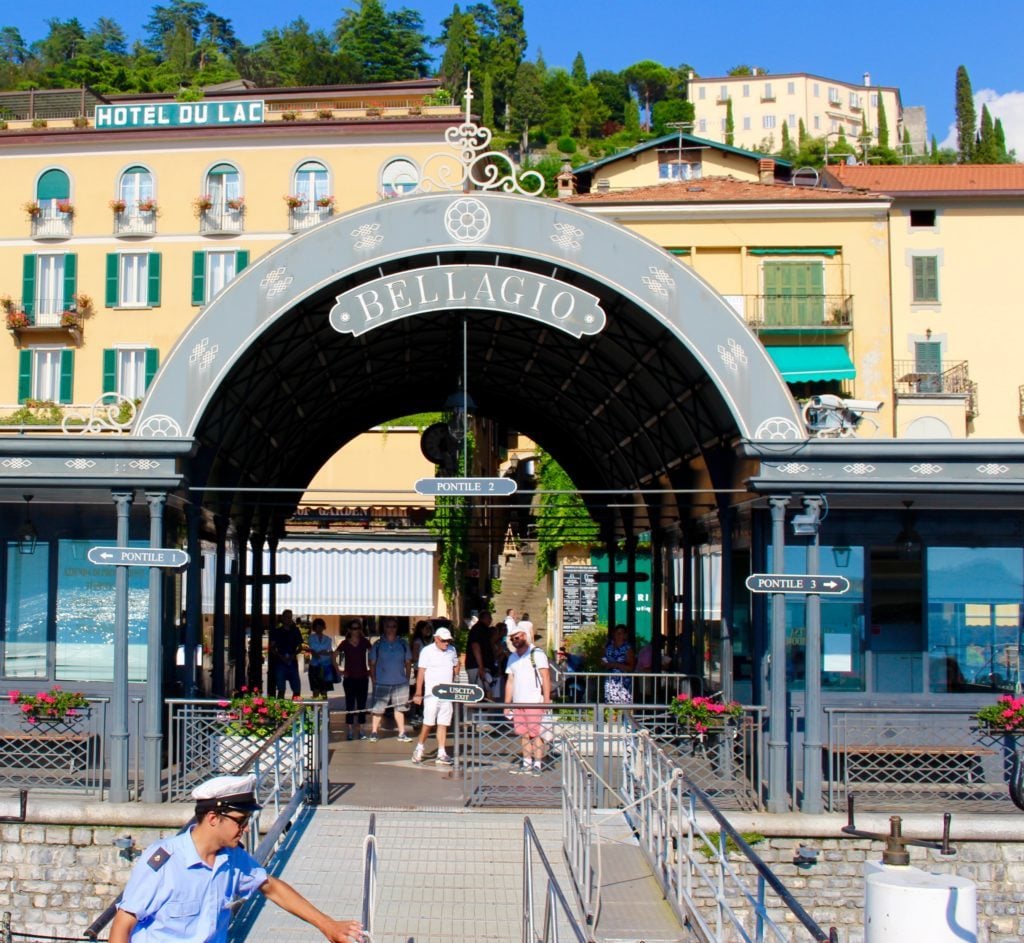 Arch with "BELLAGIO" sign by the pier. This Lake Como travel guide won't be complete without a visit to Bellagio.