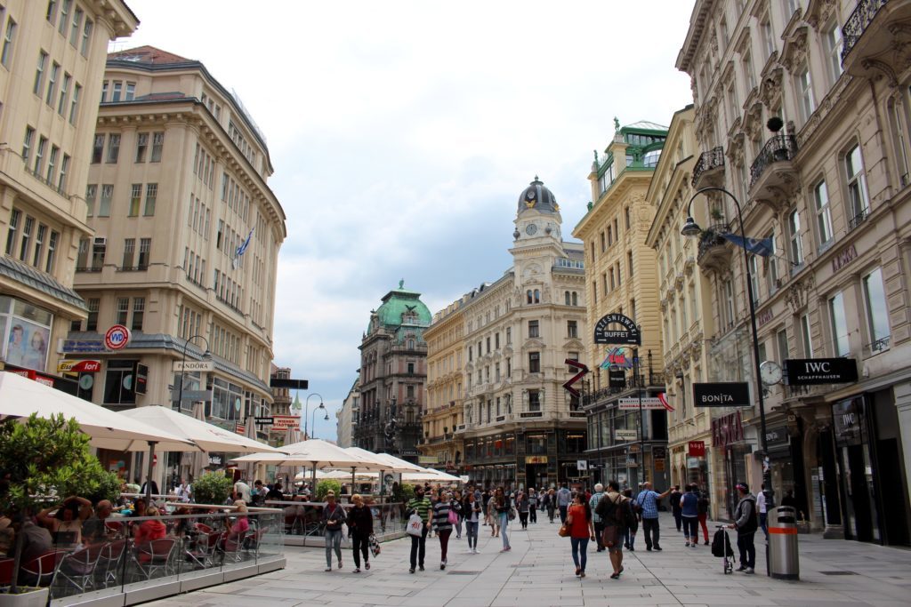 Crowd of people roaming around the beautiful streets of Vienna, Austria
