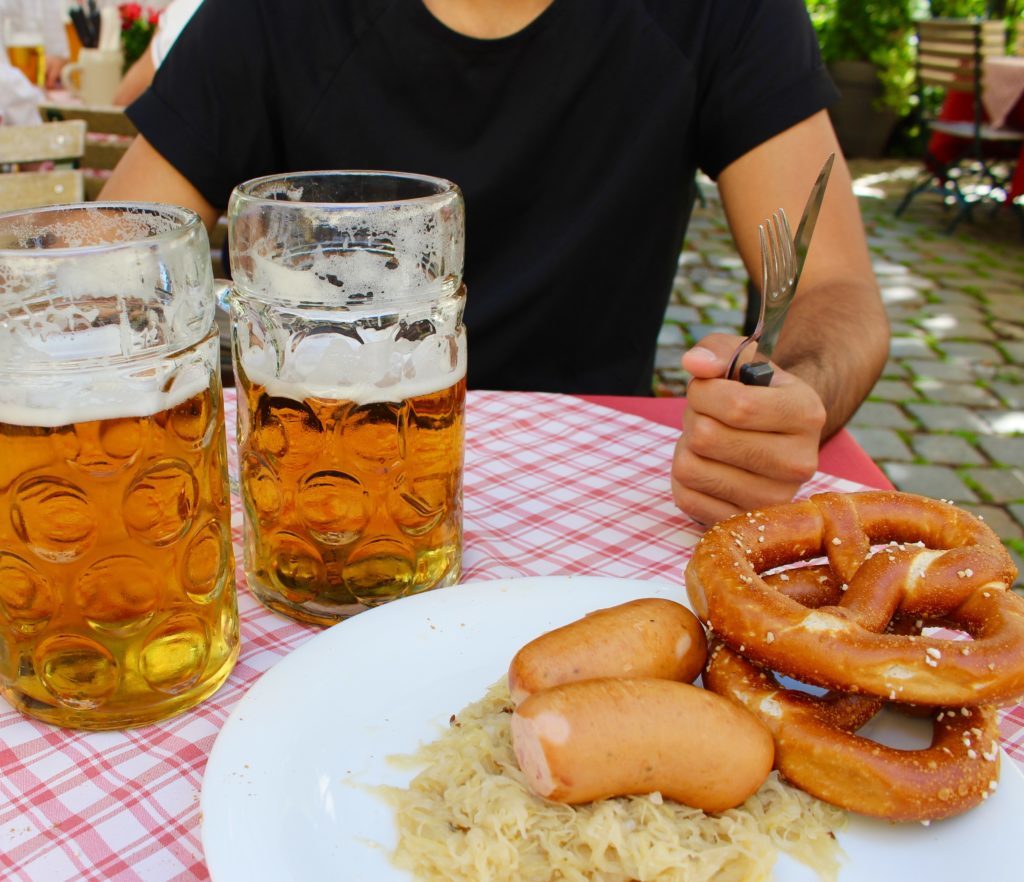 Pretzels, sausages, and mugs of beer in one of the best biergartens in Regensburg
