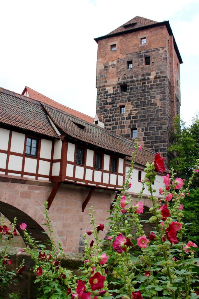 Lovely pink flowers by the Henkersteg Bridge in Nuremberg - one of the fairy tale towns in Germany