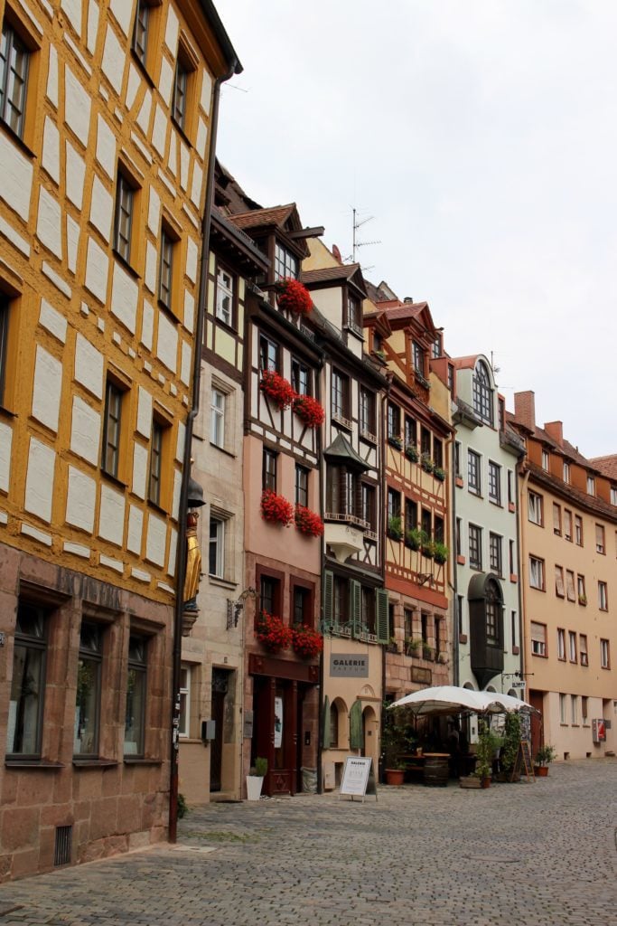 Beautiful historic buildings and cobblestone street in Nuremberg, Germany