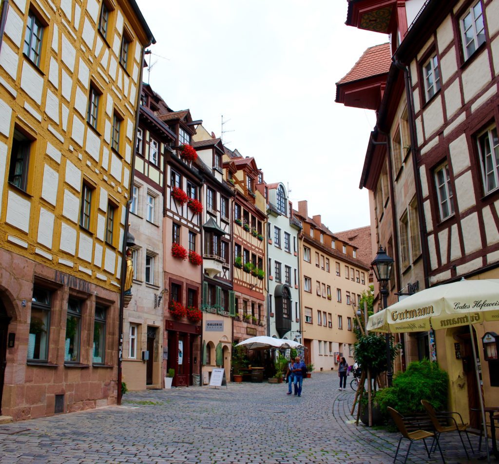 Cobblestone street surrounded by old houses in Nuremberg