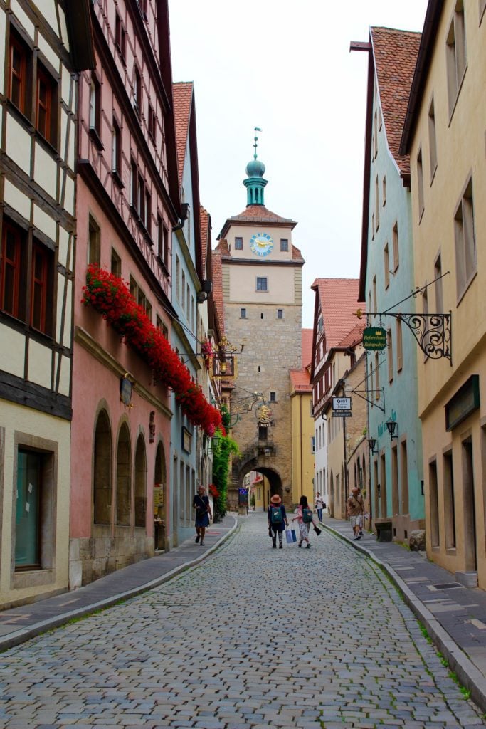 Beautiful cobblestone street leading to the clock tower of Rothenburg ob der Tauber, Germany