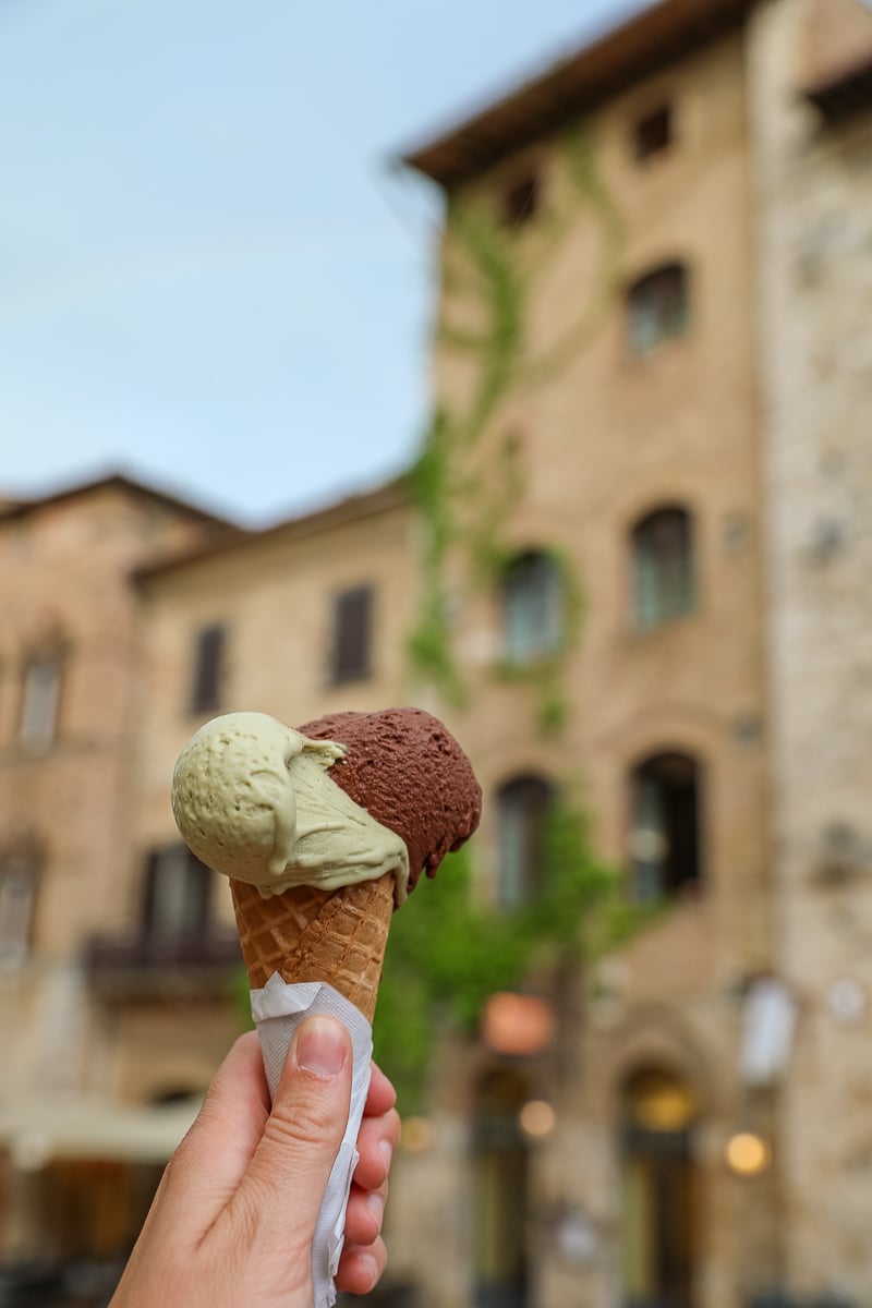 Holding up a delicious cone of gelato in San Gimignano