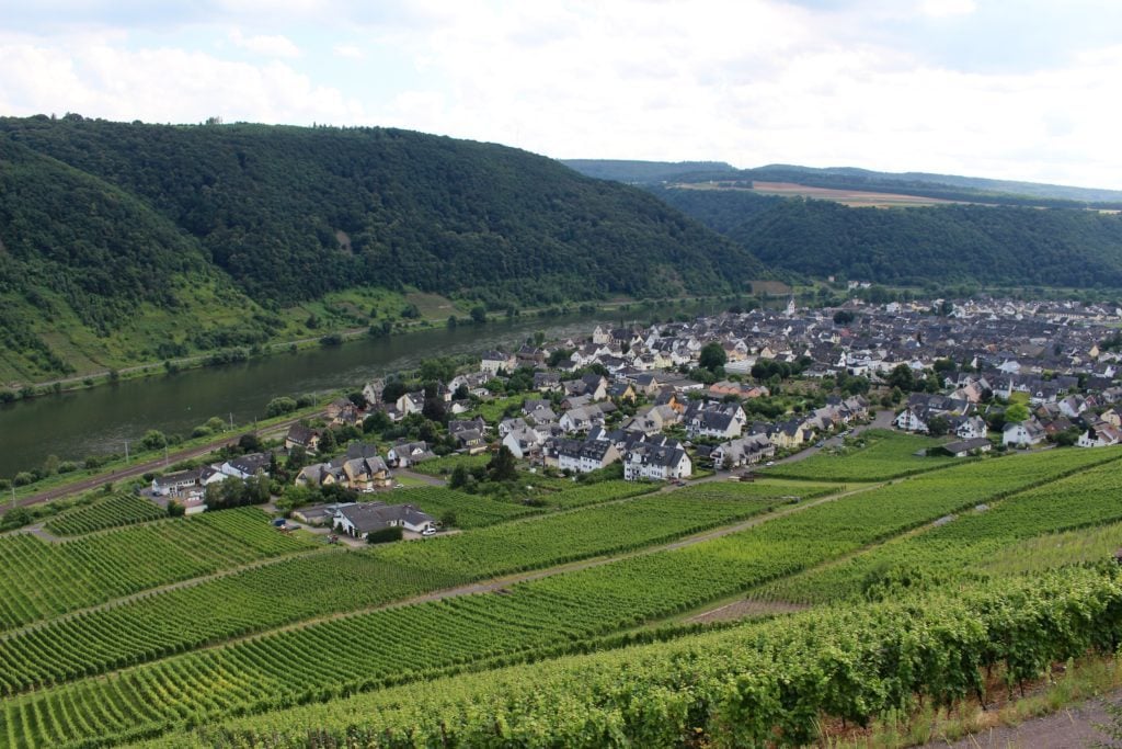 Village near lush farm fields in Koblenz, Germany. Go on a world-class voyage through the heart of Europe with the Viking River Cruises Grand European Tour.