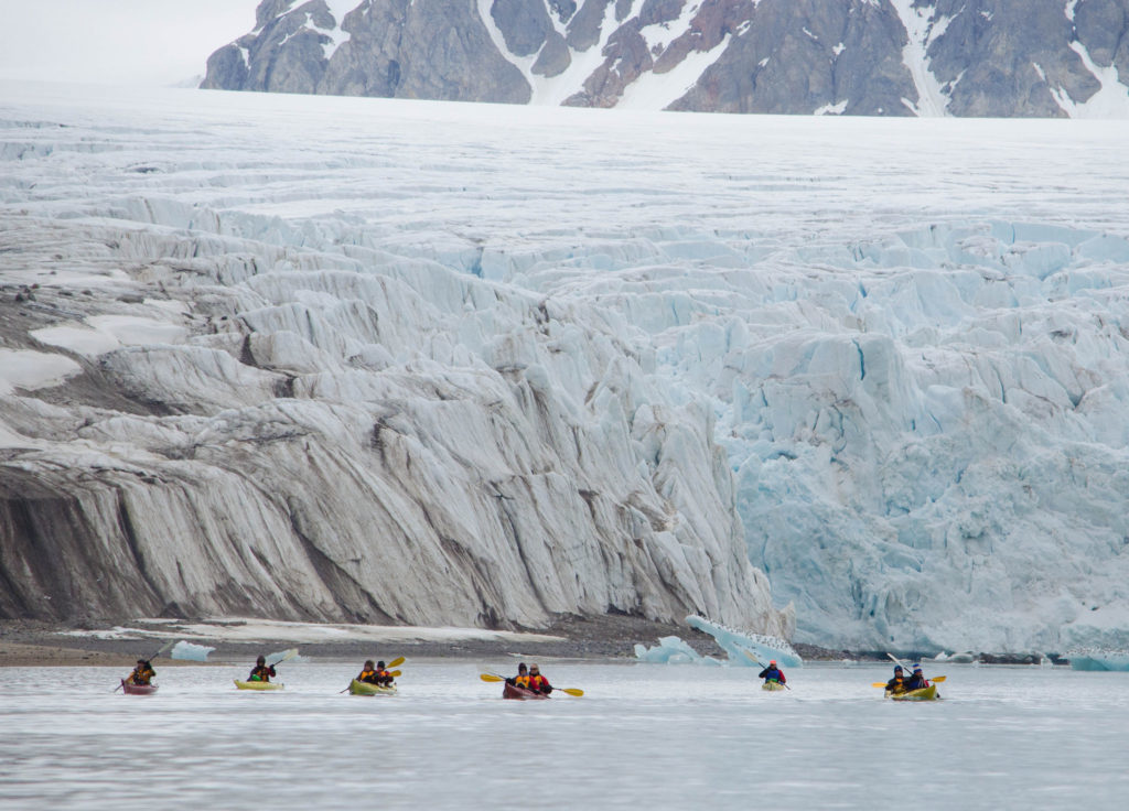 Kayakers rowing near the tall glaciers during their visit to Svalbard. Seeing photos that will make you fall in love with Norway is one thing, but seeing these gorgeous views in person is another.
