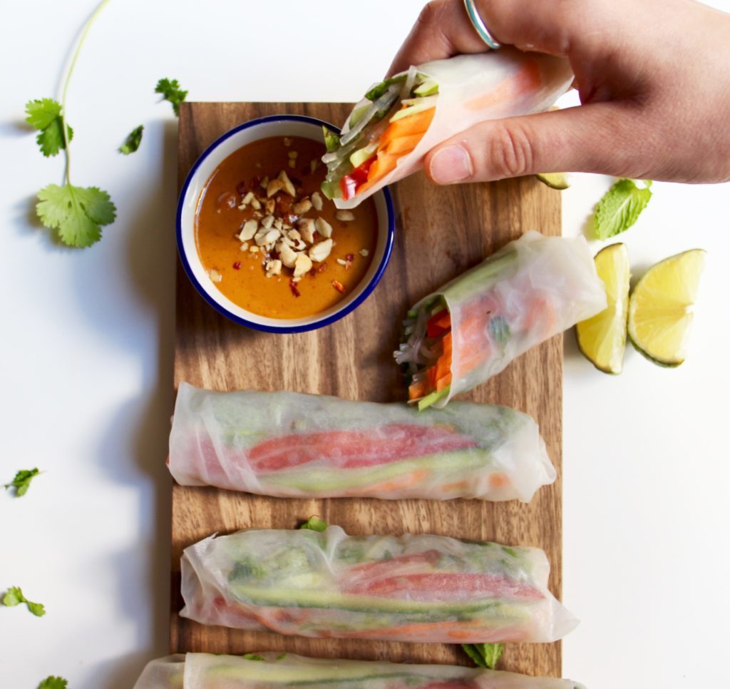 Looking for an easy and healthy, yet super satisfying Vietnamese spring rolls recipe? These vegan, gluten-free rolls are packed with fresh vegetables, flavorful herbs, noodles, and lots of beautiful, bright colors. And they're complete with a deliciously spicy peanut dipping sauce! 