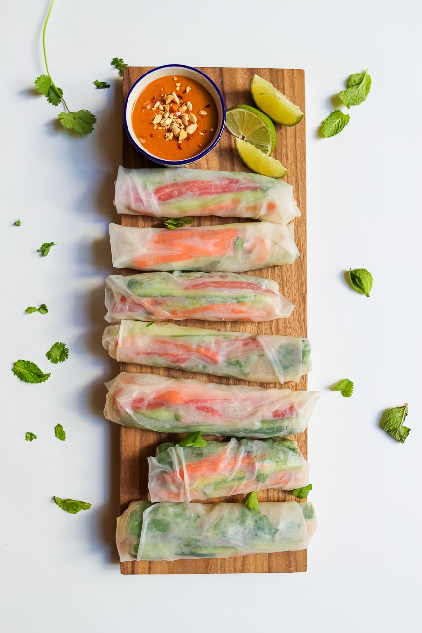 Looking for an easy and healthy, yet super satisfying Vietnamese spring rolls recipe? These vegan, gluten-free rolls are packed with fresh vegetables, flavorful herbs, noodles, and lots of beautiful, bright colors. And they're complete with a deliciously spicy peanut dipping sauce! 