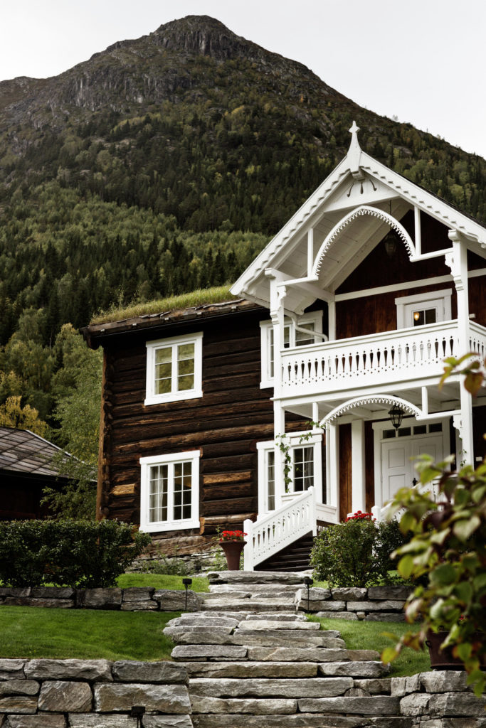 A traditional farm house at the foot of a mountain in the Oslo Region