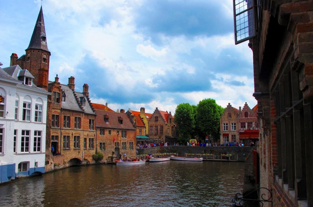 Boats on a canal surrounded by medieval buildings