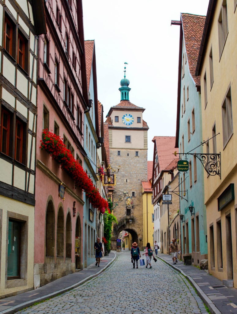 Tourists walking along the cobblestone streets in Rothenburg ob der Tauber