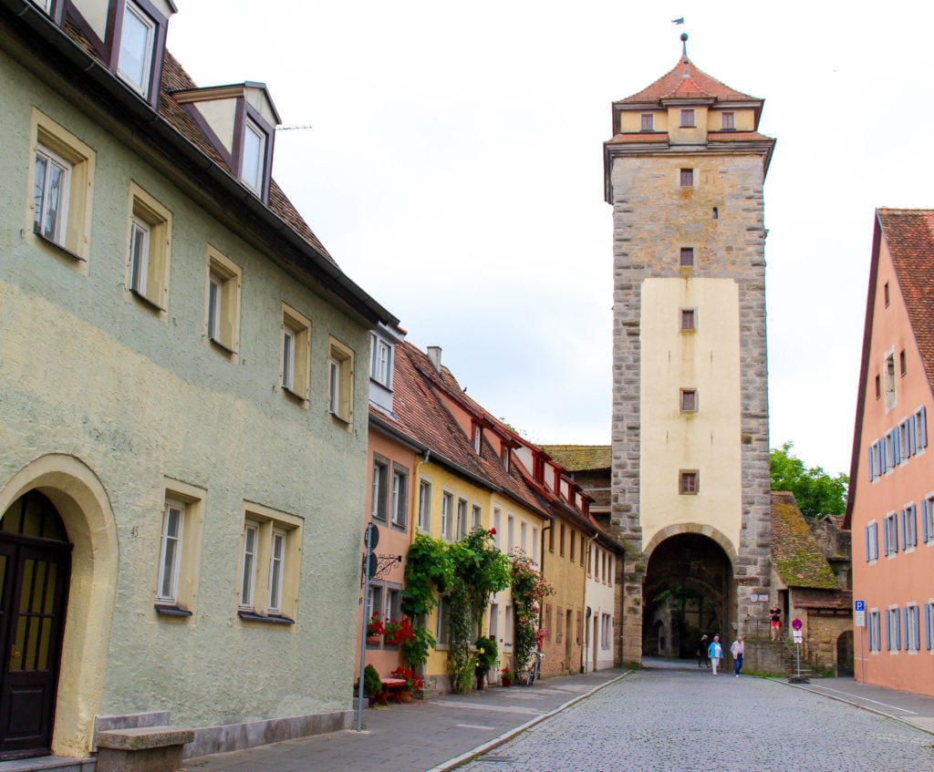 Cobblestone street with tall tower