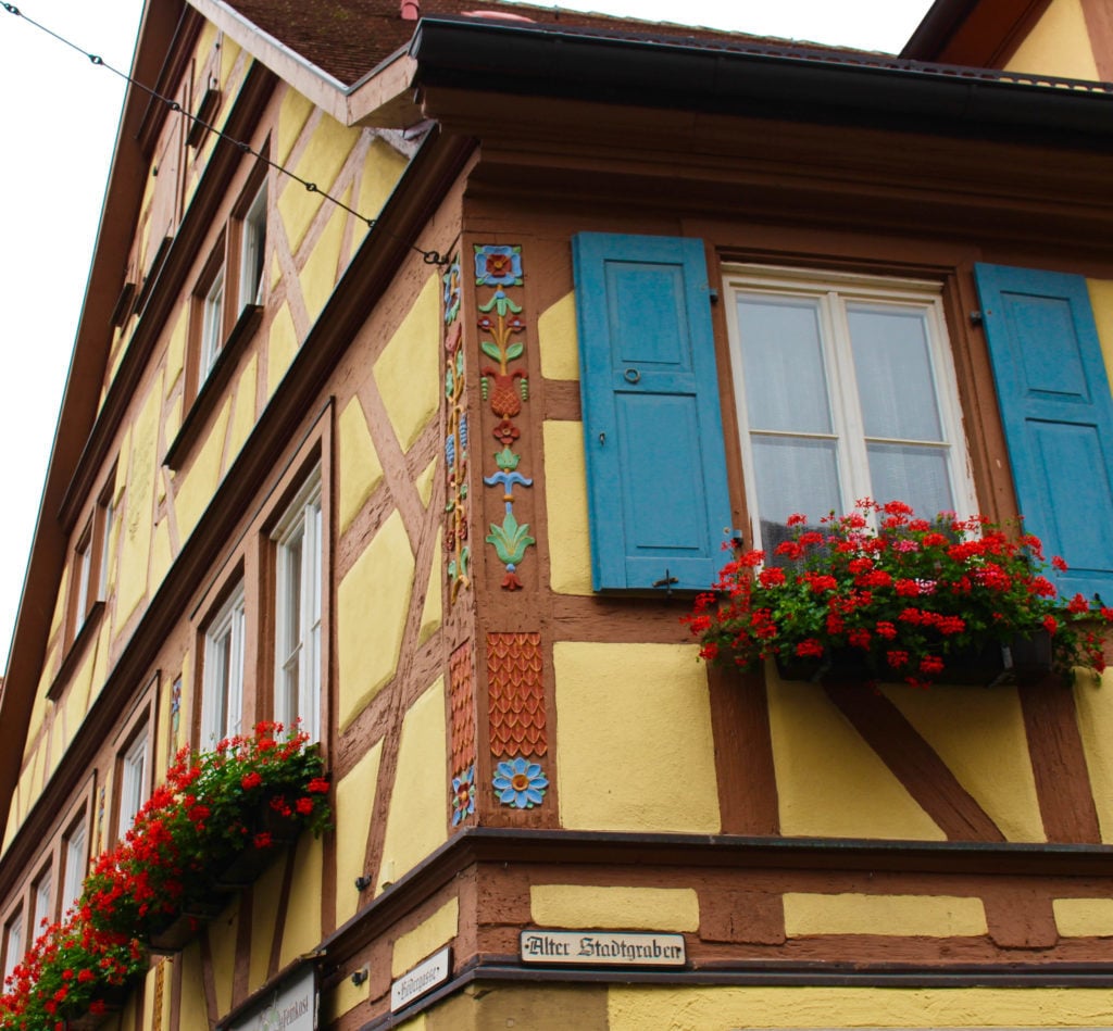 Beautiful flower details on the corner of an old house in Rothenburg ob der Tauber