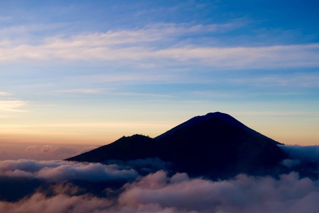 Top of a volcano surrounded by fog