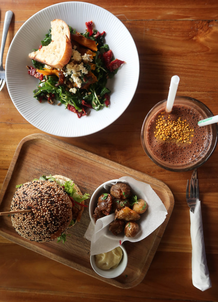 Plant-based burger and dishes at a local restaurant in Ubud
