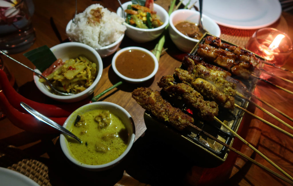 Kebab sticks and assorted Balinese food