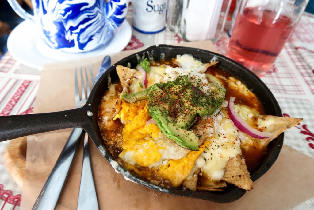 Chilaquiles on a pan at Los Amantes Café & Bistro. In this Mexico City foodie guide, we recommend having lunch in Coyoacan.