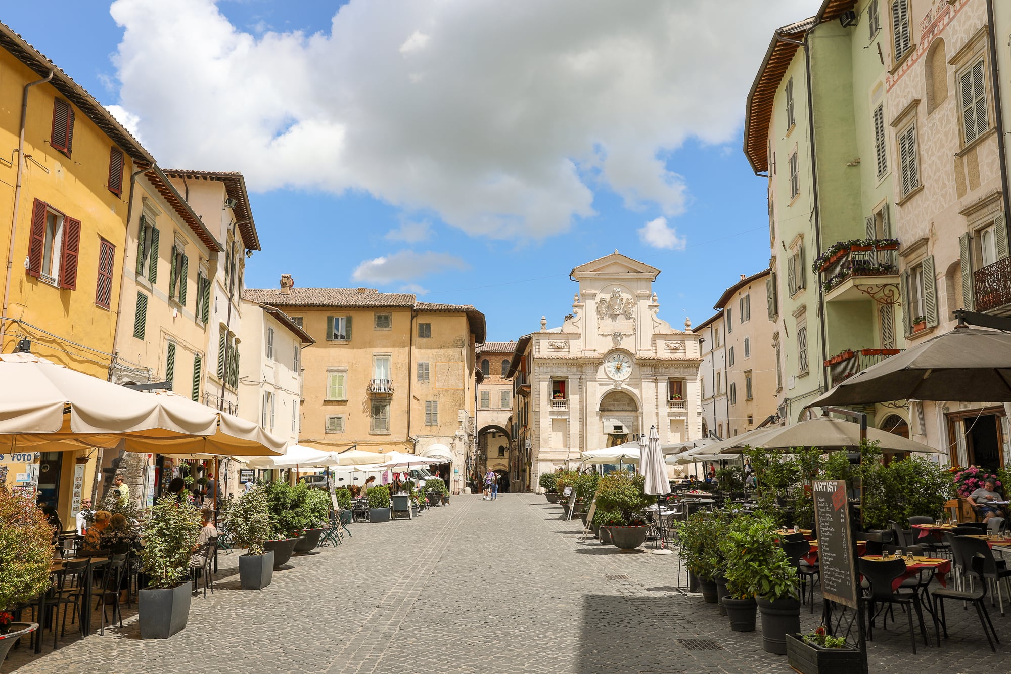 Many restaurants in a courtyard in Spoleto, Italy