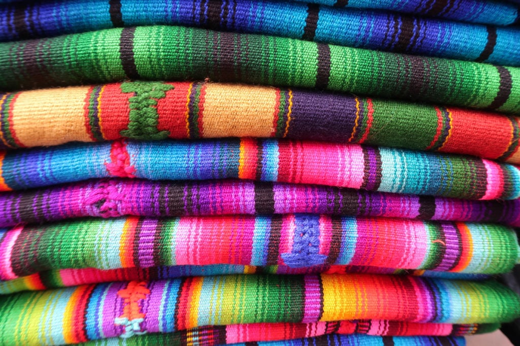 colorful guatemalan textiles from the chichicastenango market -  one of the best reasons to visit Guatemala.